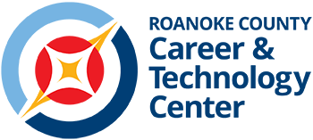 Hand holding a pencil on a scantron sheet