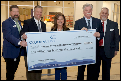 Carilion Officials present a ceremonial check for $1.25 million to RCPS