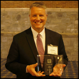 Dr. Ken Nicely with Ruby Award