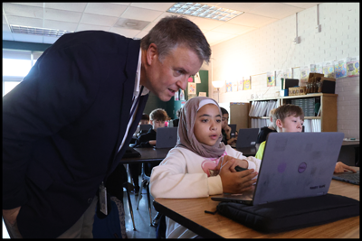 Dr. Nicely talking with a student