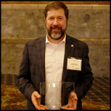 Jason Shur with STEM-H award